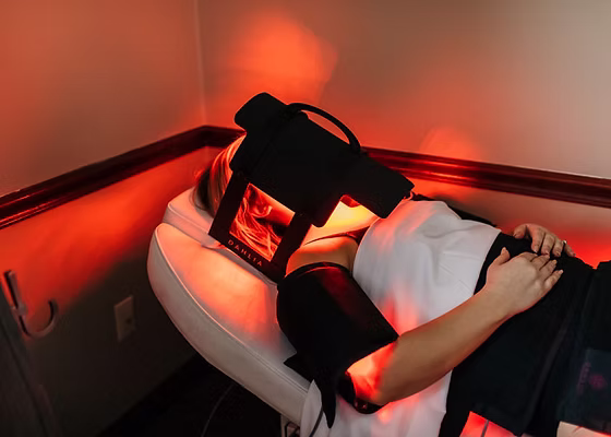 Patient receiving a red light body contouring session